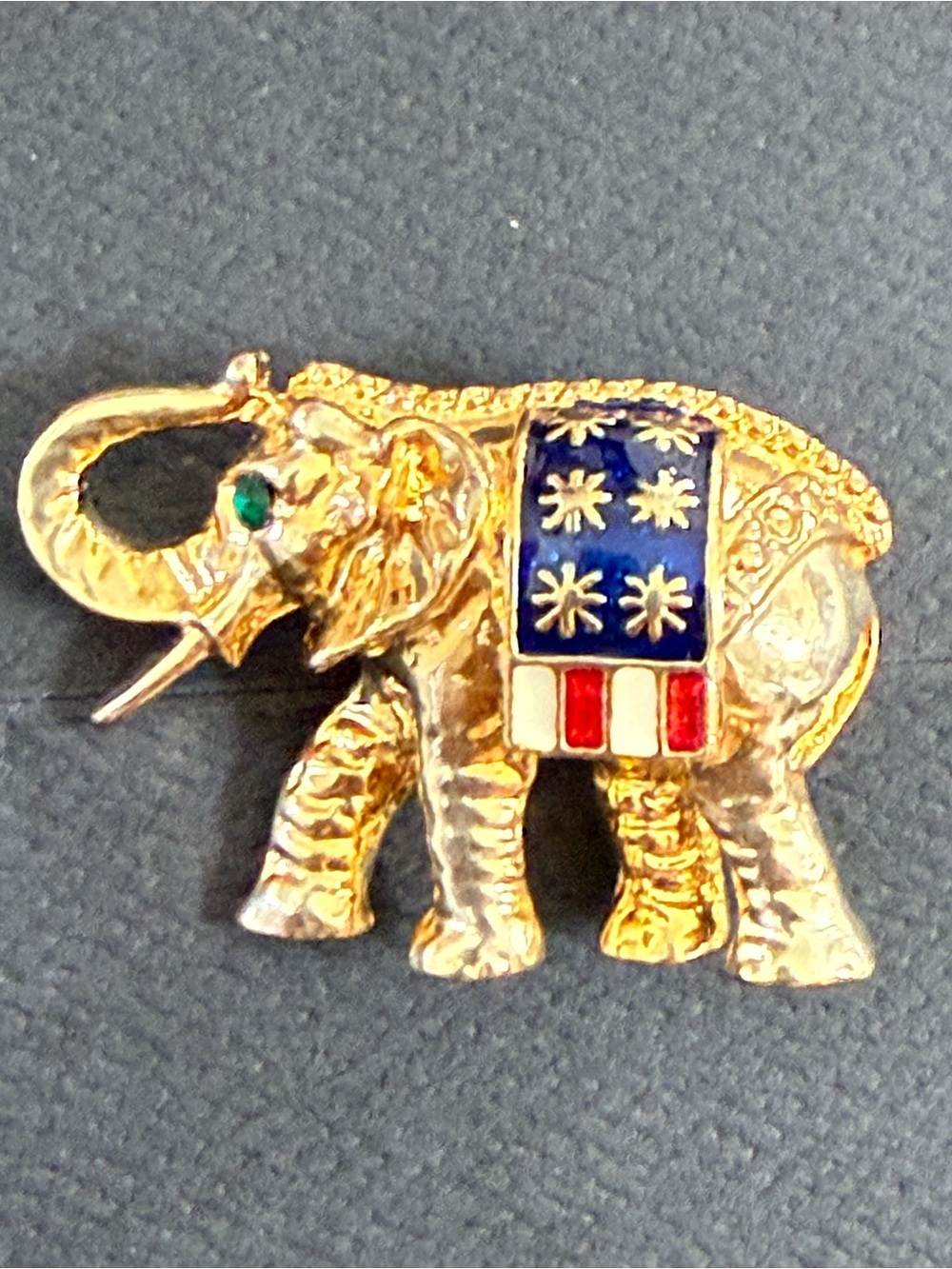 Vintage gold-tone metal , enamel patriotic elephant brooch with green stone eye